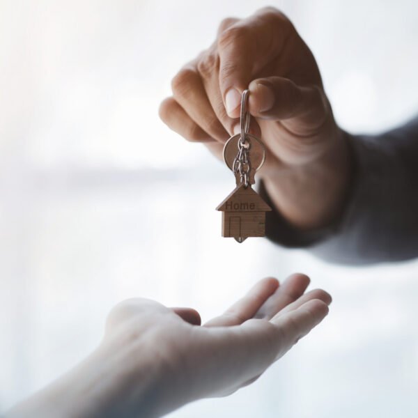 Real estate agents explain models of housing estates in projects to elaborate to clients, explaining and presenting information about homes and purchasing loans. Real estate trading concept.